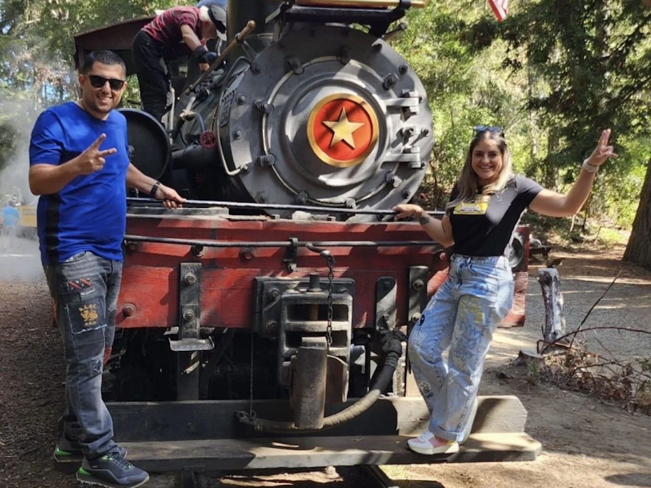 photo of Gloria and Eduardo on the front of a train